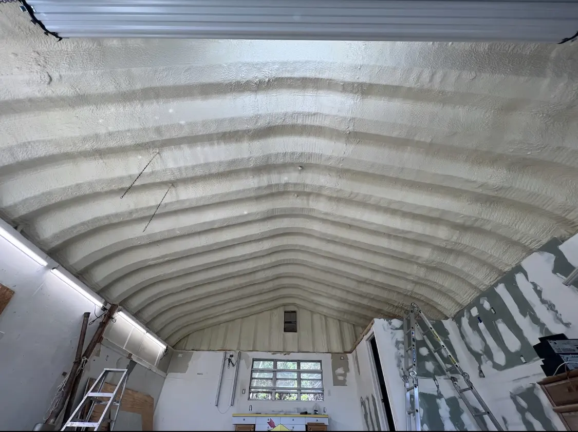 Spray polyurethane foam applied to the underside of a metal roof deck in Pearl City